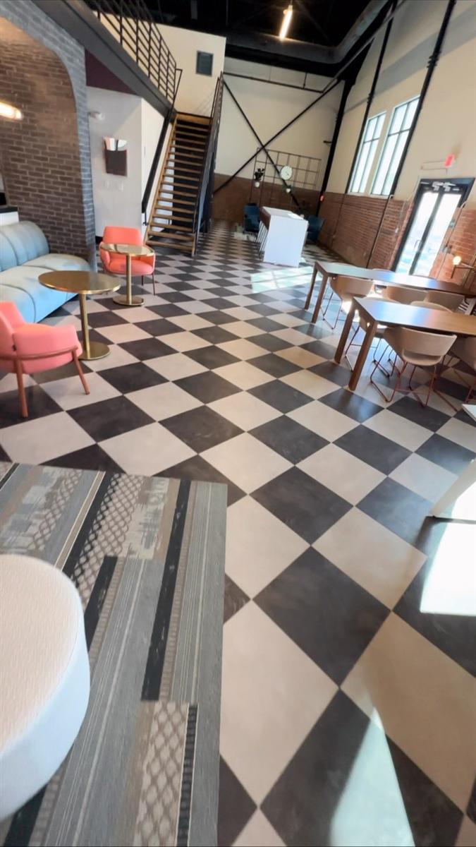 Checkerboard tile floor in a modern lounge