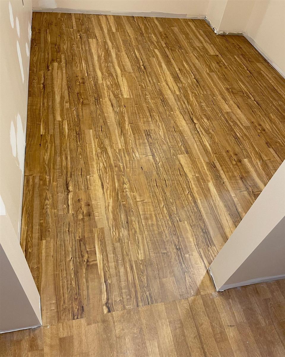 Warm wood-look vinyl tile in a residential room